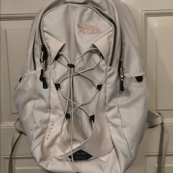 cream colored north face backpack